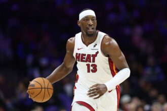 Philadelphia, Pennsylvania, USA; Miami Heat center Bam Adebayo (13) dribbles up court against the Philadelphia 76ers during the first quarter at Xfinity Mobile Arena. Mandatory Credit: Bill Streicher-Imagn Images