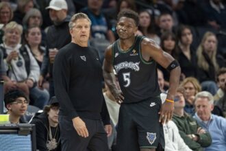 Minneapolis, Minnesota, USA; Minnesota Timberwolves head coach Chris Finch and guard Anthony Edwards (5) in the second half against the Memphis Grizzlies at Target Center. Mandatory Credit: Jesse Johnson-Imagn Images
