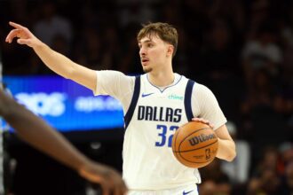 Apr 8, 2026; Phoenix, Arizona, USA; Dallas Mavericks forward Cooper Flagg (32) reacts against the Phoenix Suns in the second half at Mortgage Matchup Center. Mandatory Credit: Mark J. Rebilas-Imagn Images