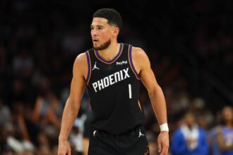Apr 27, 2026; Phoenix, Arizona, USA; Phoenix Suns guard Devin Booker (1) against the Oklahoma City Thunder during game four of the first round of the 2026 NBA Playoffs at Mortgage Matchup Center. Mandatory Credit: Mark J. Rebilas-Imagn Images