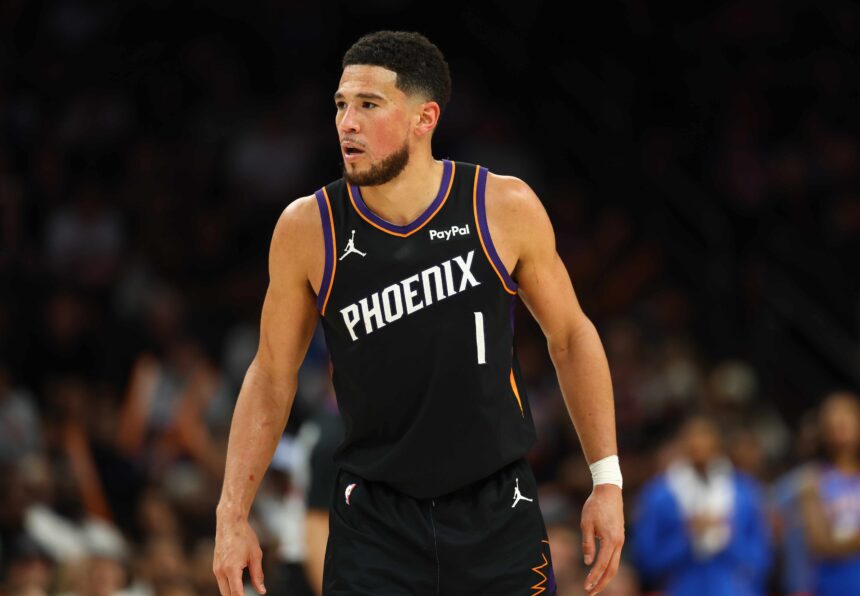 Apr 27, 2026; Phoenix, Arizona, USA; Phoenix Suns guard Devin Booker (1) against the Oklahoma City Thunder during game four of the first round of the 2026 NBA Playoffs at Mortgage Matchup Center. Mandatory Credit: Mark J. Rebilas-Imagn Images