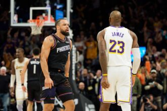 Phoenix, Arizona, USA; Phoenix Suns forward Dillon Brooks (3) and Los Angeles Lakers forward LeBron James (23) react during an altercation that resulted in a technical for Brooks during the second half of a game at at Mortgage Matchup Center. Mandatory Credit: Allan Henry-Imagn Images