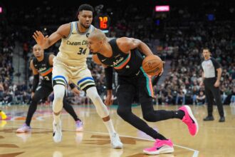 San Antonio, Texas, USA; San Antonio Spurs forward/center Victor Wembanyama (1) dribbles against Milwaukee Bucks forward Giannis Antetokounmpo (34) in the first half at Frost Bank Center. Mandatory Credit: Daniel Dunn-Imagn Images