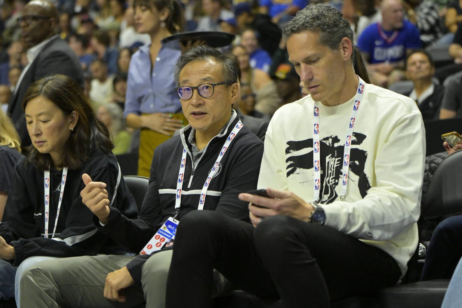 Oceanside, California, USA; Brooklyn Nets owners Clara Wu and Joseph Tsai along with Chief Executive officer Sam Zussman attend the preseason game against the Los Angeles Clippers at Frontwave Arena. Mandatory Credit: Jayne Kamin-Oncea-Imagn Images