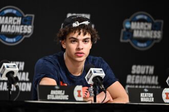 Houston, TX, USA; Illinois Fighting Illini guard Keaton Wagler (23) speaks in a press conference after defeating the Iowa Hawkeyes in an Elite Eight game of the South Regional of the men's 2026 NCAA Tournament at Toyota Center. Mandatory Credit: Maria Lysaker-Imagn Images