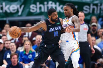 Dallas, Texas, USA; Dallas Mavericks guard Kyrie Irving (11) controls the ball as Oklahoma City Thunder guard Cason Wallace (22) defends during the second quarter in game six of the second round of the 2024 NBA playoffs at American Airlines Center. Mandatory Credit: Kevin Jairaj-USA TODAY Sports