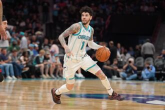 Charlotte, North Carolina, USA; Charlotte Hornets guard LaMelo Ball (1) moves the ball during the second half during the play-in rounds between the Charlotte Hornets and the Miami Heat of the 2026 NBA Playoffs at Spectrum Center. Mandatory Credit: Jim Dedmon-Imagn Images