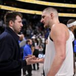 Dallas, Texas, USA; Dallas Mavericks guard Luka Doncic (left) talks with Denver Nuggets center Nikola Jokic (right) after the game at the American Airlines Center. Mandatory Credit: Jerome Miron-Imagn Images