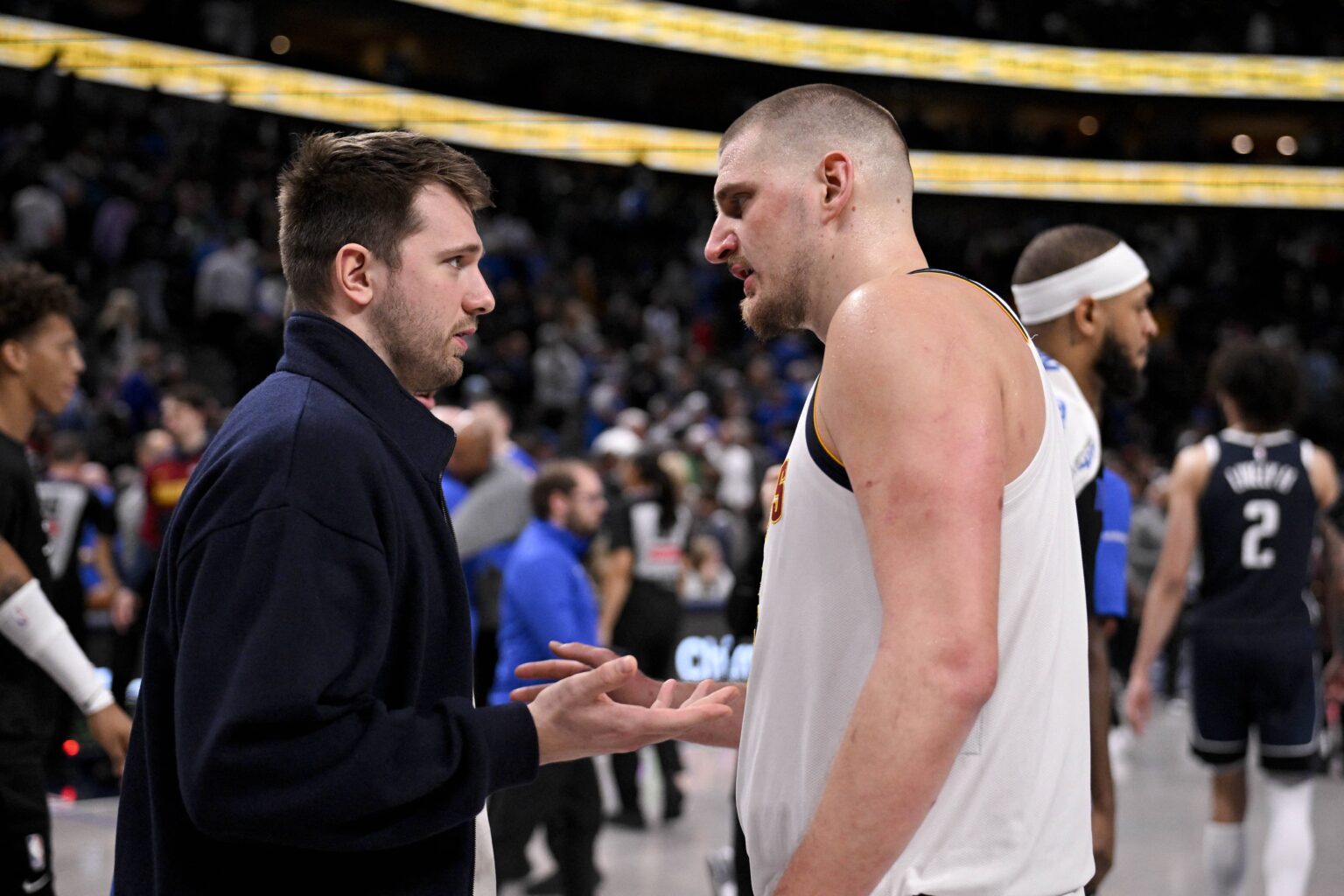 Dallas, Texas, USA; Dallas Mavericks guard Luka Doncic (left) talks with Denver Nuggets center Nikola Jokic (right) after the game at the American Airlines Center. Mandatory Credit: Jerome Miron-Imagn Images