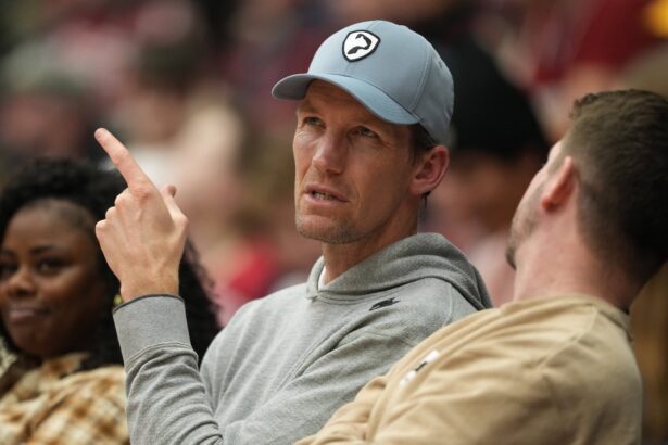 Stanford, California, USA; Golden State Warriors general manager Mike Dunleavy Jr. sits courtside during the first half of the game between the Stanford Cardinal and the CSUN Matadors at Maples Pavilion. Mandatory Credit: Darren Yamashita-Imagn Images