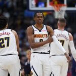 Denver, Colorado, USA; Denver Nuggets guard Peyton Watson (8) and guard Jamal Murray (27) during the first quarter against the Brooklyn Nets at Ball Arena. Mandatory Credit: Ron Chenoy-Imagn Images