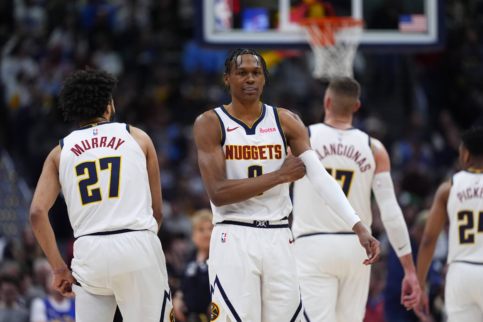 Denver, Colorado, USA; Denver Nuggets guard Peyton Watson (8) and guard Jamal Murray (27) during the first quarter against the Brooklyn Nets at Ball Arena. Mandatory Credit: Ron Chenoy-Imagn Images