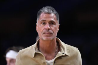 Los Angeles, California, USA; Los Angeles Lakers general manager Rob Pelinka watches during game one of the first round of the 2026 NBA Playoffs against the Houston Rockets at Crypto.com Arena. Mandatory Credit: Kirby Lee-Imagn Images