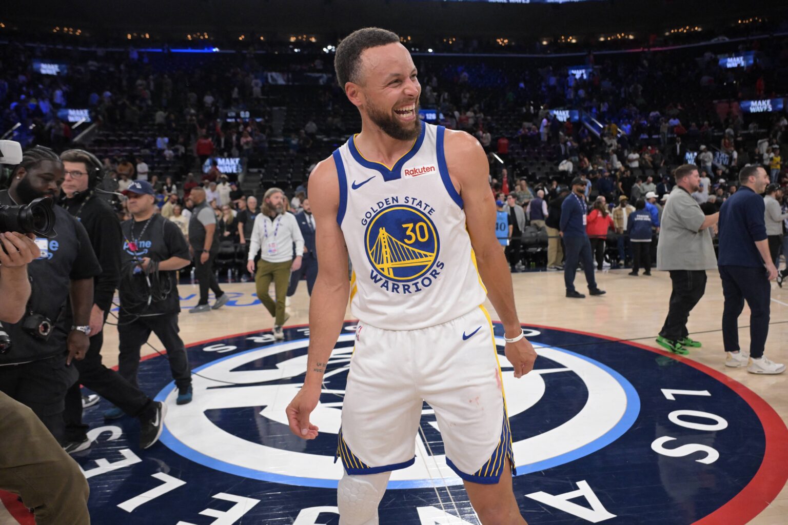 Inglewood, California, USA; Golden State Warriors guard Stephen Curry (30) smiles on the court after defeating the Los Angeles Clippers during the play-in rounds of the 2026 NBA Playoffs at Intuit Dome. Mandatory Credit: Jayne Kamin-Oncea-Imagn Images