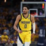 Indianapolis, Indiana, USA; Indiana Pacers guard Tyrese Haliburton (0) reacts after shooting a three point basket during the second quarter against the New York Knicks of game four of the eastern conference finals for the 2025 NBA Playoffs at Gainbridge Fieldhouse. Mandatory Credit: Trevor Ruszkowski-Imagn Images