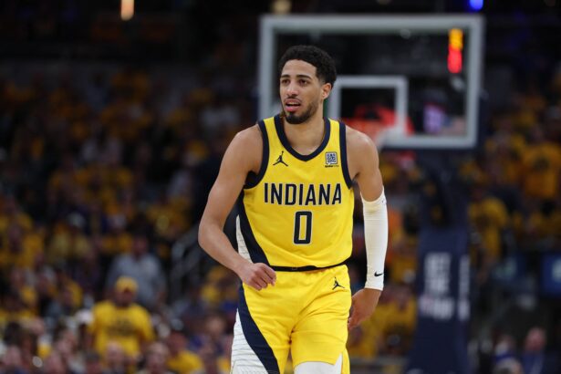 Indianapolis, Indiana, USA; Indiana Pacers guard Tyrese Haliburton (0) reacts after shooting a three point basket during the second quarter against the New York Knicks of game four of the eastern conference finals for the 2025 NBA Playoffs at Gainbridge Fieldhouse. Mandatory Credit: Trevor Ruszkowski-Imagn Images