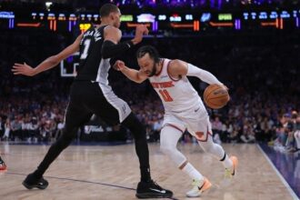 New York, New York, USA; New York Knicks guard Jalen Brunson (11) controls the ball against San Antonio Spurs forward Victor Wembanyama (1) in the second quarter during game four of the 2026 NBA Finals at Madison Square Garden. Mandatory Credit: Brad Penner-Imagn Images