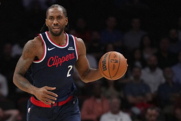 Dec 1, 2025; Miami, Florida, USA; Los Angeles Clippers forward Kawhi Leonard (2) brings the ball up the court against the Miami Heat during the first half at Kaseya Center. Mandatory Credit: Jim Rassol-Imagn Images