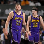 Apr 9, 2025; Dallas, Texas, USA; Los Angeles Lakers guard Luka Doncic (77) and guard Austin Reaves (15) during the game between the Dallas Mavericks and the Los Angeles Lakers at American Airlines Center. Mandatory Credit: Jerome Miron-Imagn Images