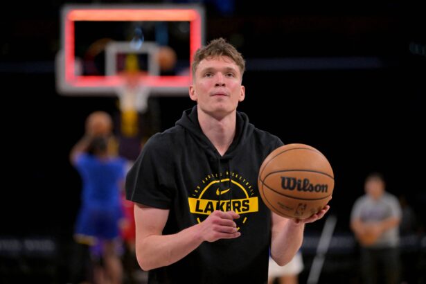 Los Angeles, California, USA; Los Angeles Lakers forward Dalton Knecht (4) warms up prior to the game against the Golden State Warriors at Crypto.com Arena. Mandatory Credit: Jayne Kamin-Oncea-Imagn Images