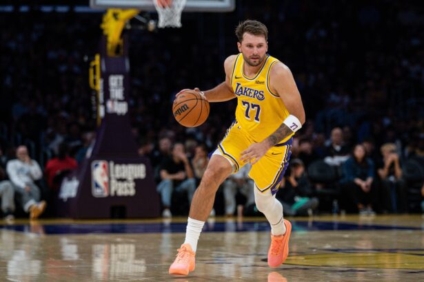 Los Angeles, California, USA; Los Angeles Lakers guard Luka Doncic (77) dribbles during the first quarter at Crypto.com Arena. Mandatory Credit: Jon Endow-Imagn Images